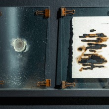 Mahsa Aleph, «صفحه ی ۱۶۴», from ”The Sworn Words” Series, metal clip, glass, book paper, sulfur dioxide, sulfur ash, paper swarf, 21 x29 cm, 2018